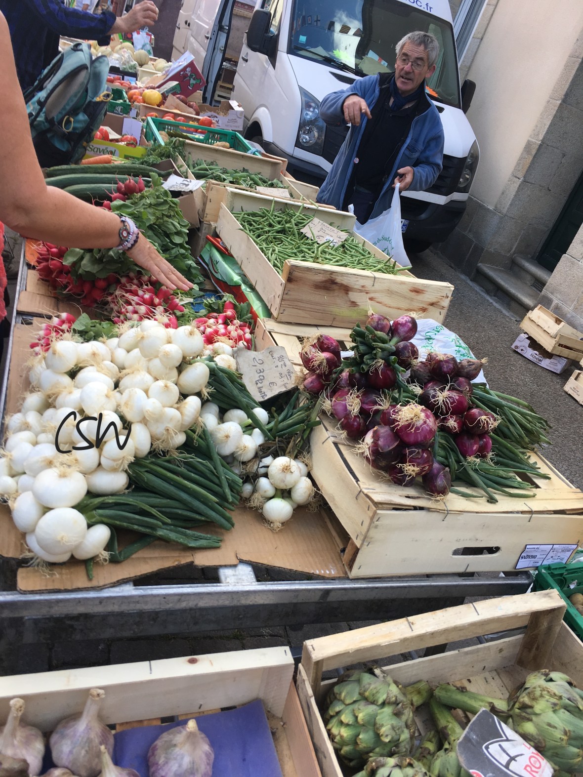 Au marché, Guilvinec. I love the French markets. This man sold delicious vegetables and potatoes. He spoke Breton with most of his customers. 